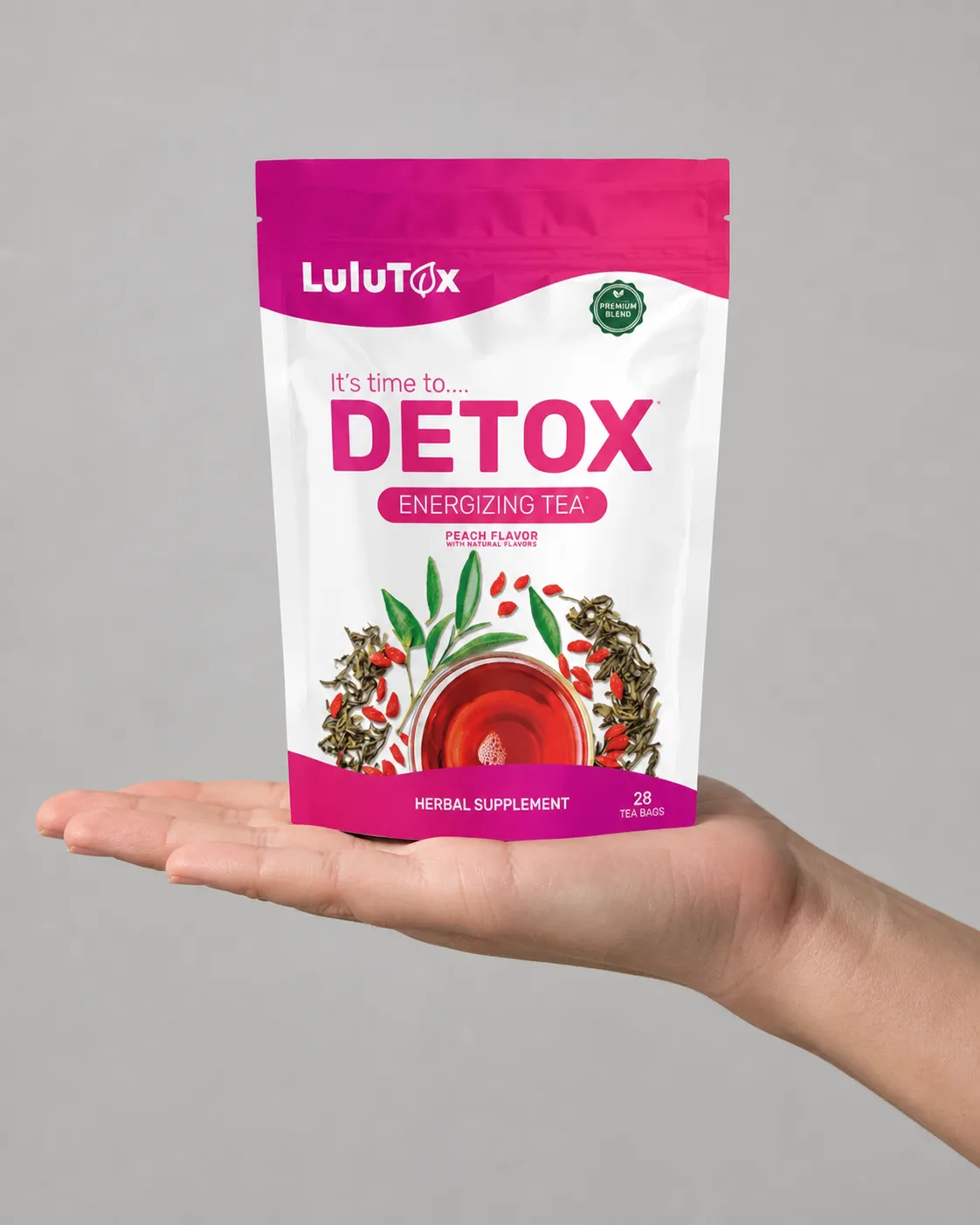 Lulutox Detox Tea HCTC — the package held in a hand